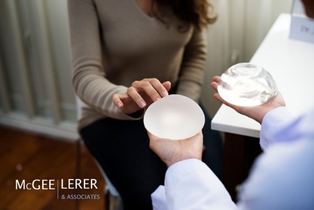 Woman chooses between breast implant materials