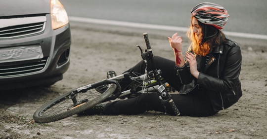 woman on bike injured by car