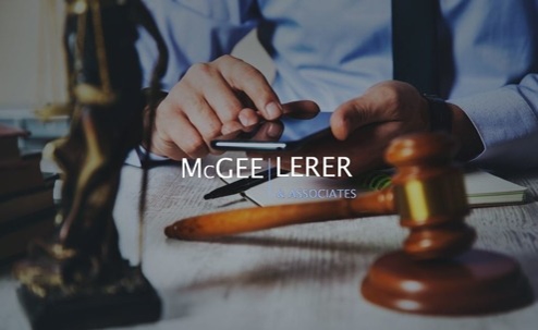 A law office advertisement, featuring a gavel and a partially visible statue of justice.