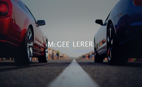 Red car and blue car race down the street