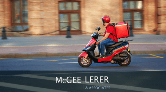 Food delivery man on red scooter with  isothermal food case box