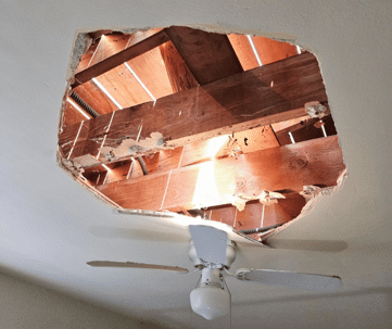 Damage home ceiling in restroom, water leak out from piping system make ceiling damaged