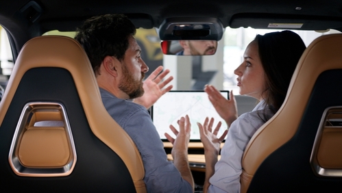 Angry Caucasian couple arguing inside car conflict talking breakup divorce woman girl female girlfriend quarrel with man guy male boyfriend travel navigation problem stress automobile auto argument