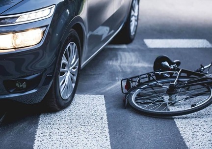 A car has struck a bicycle