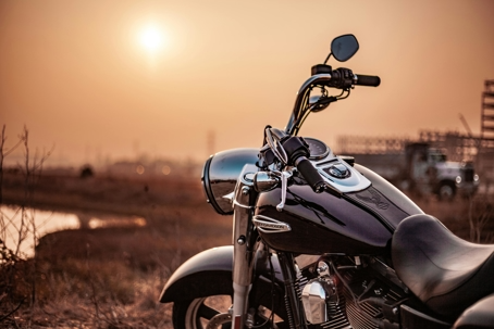 a motorcycle against a sunrise