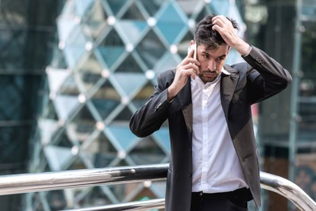 a man calling his insurance adjuster