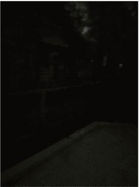 image of gap between carport and trench in darkness
