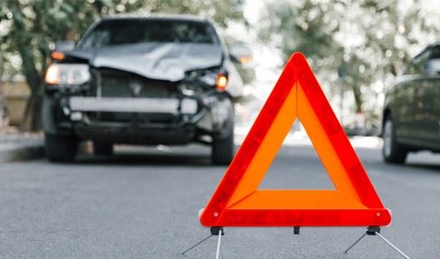 damaged car parked on road after car crash